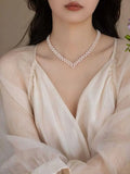 V-neck crocheted necklace that exudes elegance. Natural freshwater AK pearl necklace. TWINKLE QUEEN